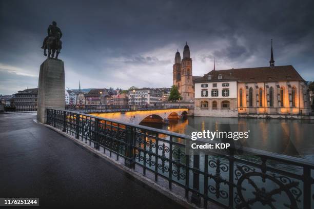 cityscape downtown and business financial of zurich city at twilight sunset, beautiful scenery view of architectural old town city of zurich, switzerland. europe travel destination and vacation time - grossmünster stock-fotos und bilder