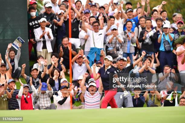 Fans cheer as Hinako Shibuno of Japan makes a chip-in birdie on the 16th green during the final round of the Descente Ladies Tokai Classic at Shin...