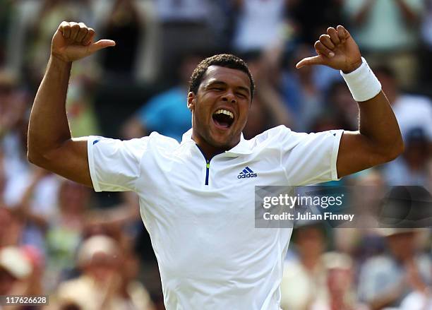 Jo-Wilfried Tsonga of France celebrates after winning his quarterfinal round match against Roger Federer of Switzerland on Day Nine of the Wimbledon...