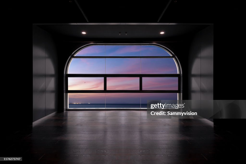 Dramatic sky during sunset, from Futuristic empty room-composited image.