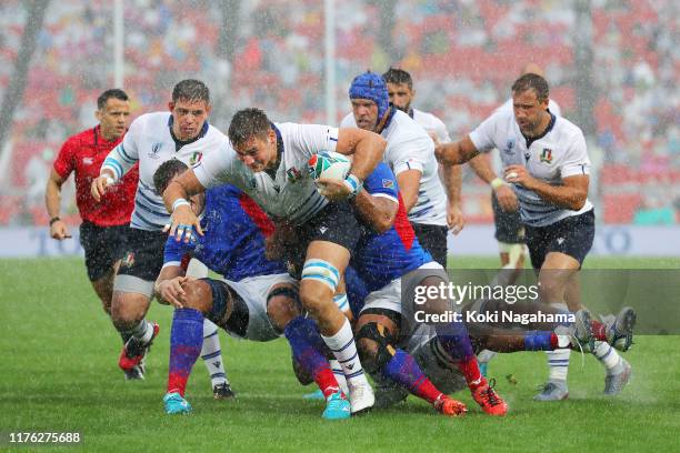 Jake Polledri of Italy is tackled during the Rugby World Cup 2019 Group B game between Italy and Namibia at Hanazono Rugby Stadium on September 22,...