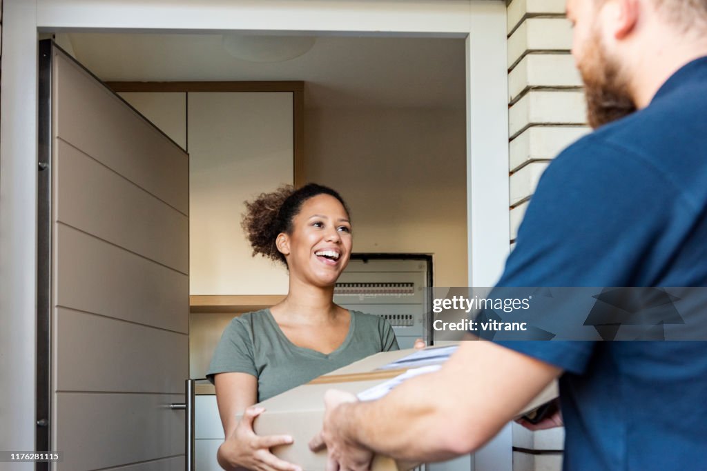 Client Delivery Home Delivery Of A Box To The Client High-Res Stock Photo - Getty Images
