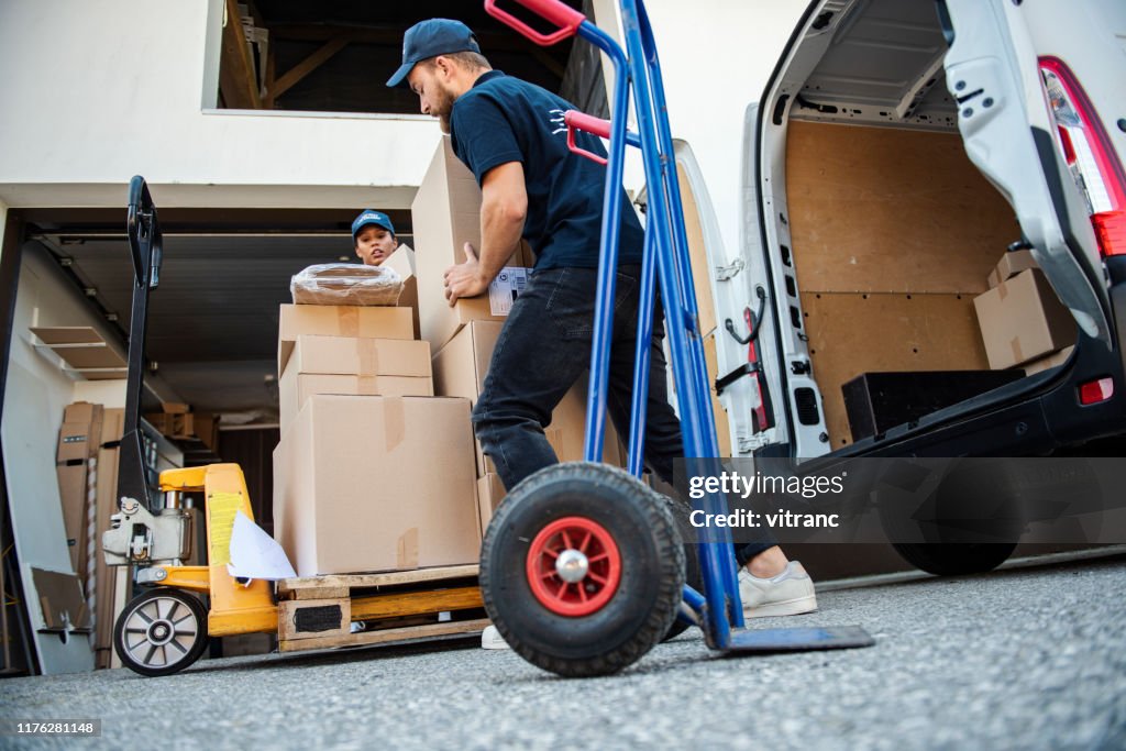 Delivery Workers Loading Delivery Van