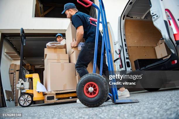 delivery workers loading delivery van - hand truck stock pictures, royalty-free photos & images