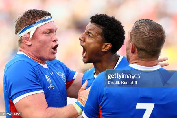 Chad Plato of Namibia celebrates scoring his side third try with his team mates during the Rugby World Cup 2019 Group B game between Italy and...