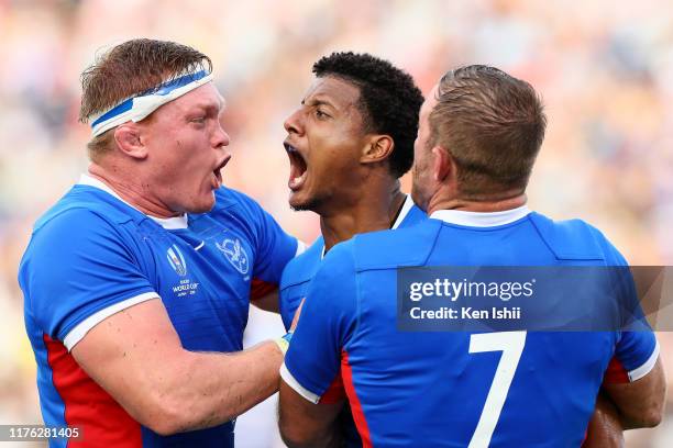 Chad Plato of Namibia celebrates scoring his side third try with his team mates during the Rugby World Cup 2019 Group B game between Italy and...