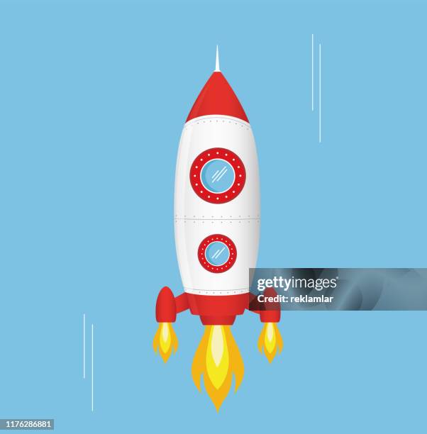 flying cartoon rocket in flat style isolated on blue background - cartoon spaceship stock illustrations