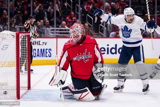 Alexander Kerfoot of the Toronto Maple Leafs celebrates after John Tavares a scores a goal against Ilya Samsonov of the Washington Capitals during...