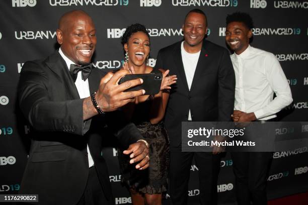 Tyrease Gibson, Nafessa Williams, Deon Taylor and Mike Coulter attend the premiere of "Black and Blue" on day four of the 2019 Urbanworld Film...