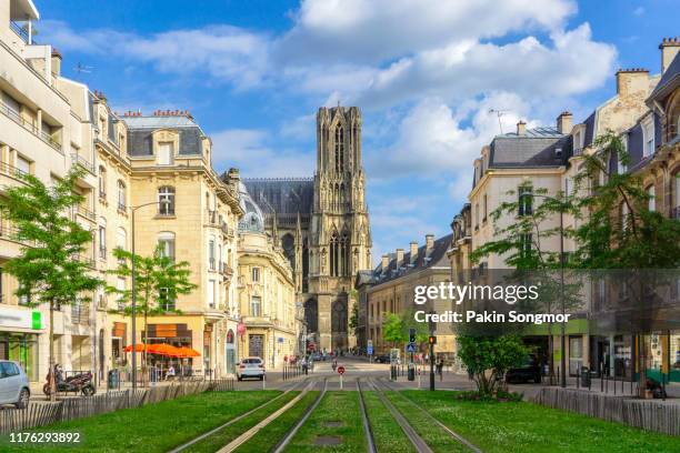 city street amidst old buildings at reims city - reims imagens e fotografias de stock