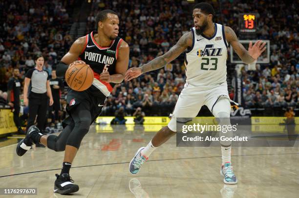 Rodney Hood of the Portland Trail Blazers drives around Royce O'Neale of the Utah Jazz at Vivint Smart Home Arena on October 16, 2019 in Salt Lake...