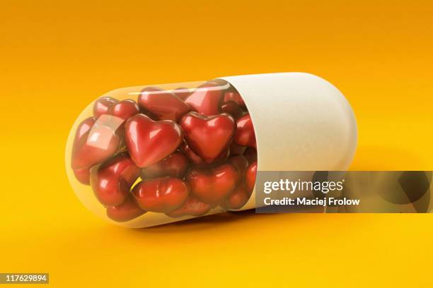hearts inside a pill - pill stock illustrations