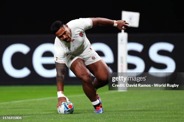 Manu Tuilagi of England grounds the ball to score his side's second try during the Rugby World Cup 2019 Group C game between England and Tonga at...