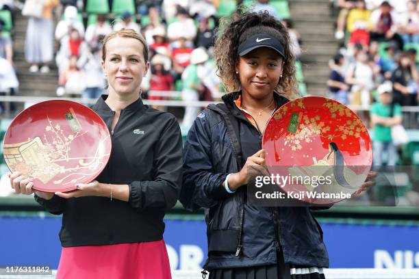 Singles champion Naomi Osaka of Japan poses for photographs with the trophy after the Singles final agains Anastasia Pavlyuchenkova of Russia during...