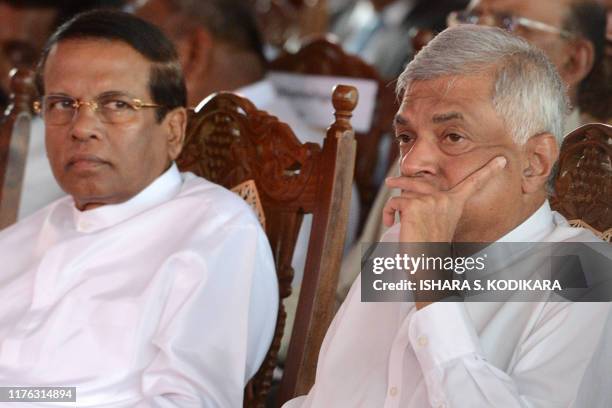 Sri Lankan President Maithripala Sirisena and Sri Lankan Prime Minister Ranil Wickremesinghe look on during a ceremony at Jaffna International...