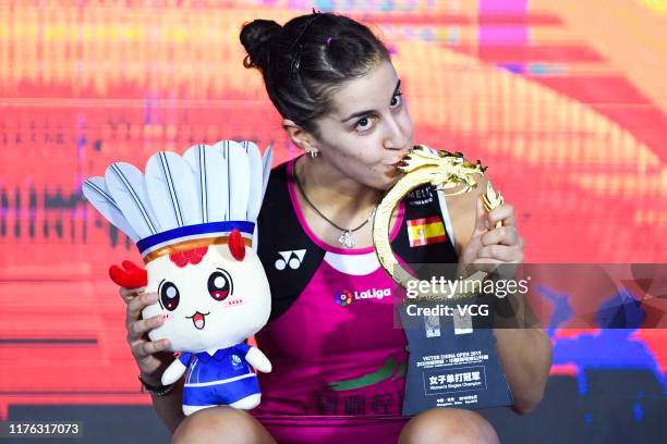 Carolina Marin of Spain celebrates with the trophy on the podium after winning the Women's Singles final match against Tai Tzu Ying of Chinese Taipei...