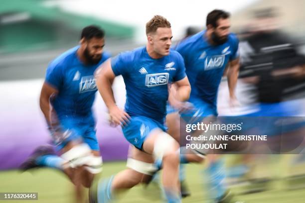 New Zealand's flanker Sam Cane takes part in a team training session at Tatsuminomori Seaside Park in Koto City in Tokyo on October 17 during the...