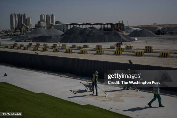 Workers are seen near Lusail Stadium that is under construction for the upcoming World Cup on Thursday, July 11 in Doha, Qatar.