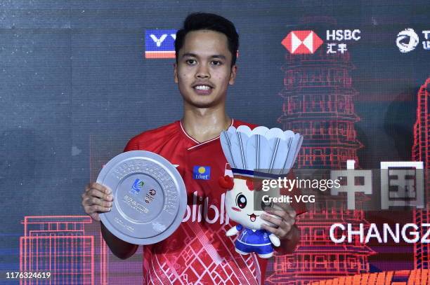 The runner-up Anthony Sinisuka Ginting of Indonesia poses with his trophy on the podium after the Men's Singles final match on day six of 2019 China...