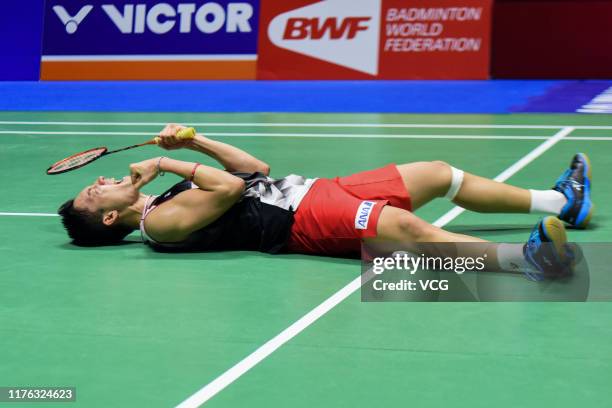 Kento Momota of Japan celebrates victory after the Men's Singles final match against Anthony Sinisuka Ginting of Indonesia on day six of 2019 China...