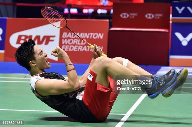 Kento Momota of Japan celebrates victory after the Men's Singles final match against Anthony Sinisuka Ginting of Indonesia on day six of 2019 China...