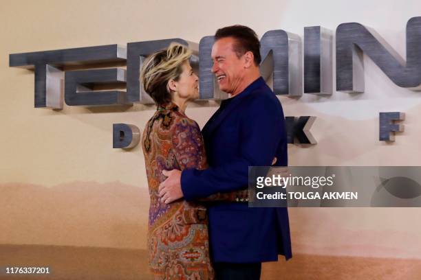 Austrian-US actor Arnold Schwarzenegger and US actress Linda Hamilton pose during a photo call to promote the film Terminator: Dark Fate in London on...