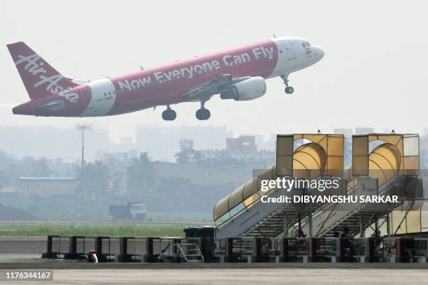 An AirAsia aircraft takes off at Netaji Subhas Chandra Bose International Airport in Kolkata on October 17, 2019.