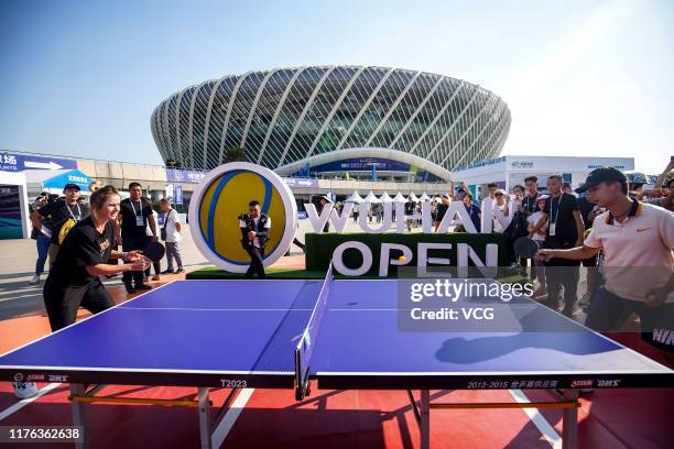 Elina Svitolina of the Ukraine plays table tennis as she meets fans on Day one of 2019 Dongfeng Motor Wuhan Open at Optics Valley International...