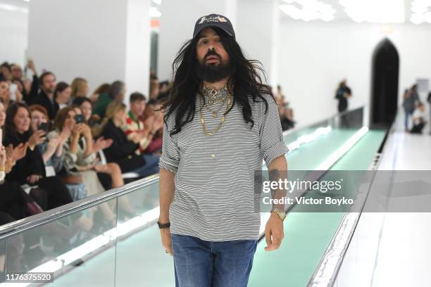 Designer Alessandro Michele acknowledges the applause of the audience at the Gucci Spring/Summer 2020 fashion show during Milan Fashion Week on...