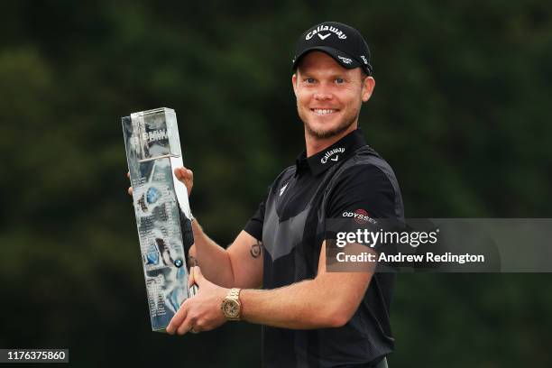 Danny Willett of England poses with the winners trophy following victory at the BMW PGA Championship at Wentworth Golf Club on September 22, 2019 in...