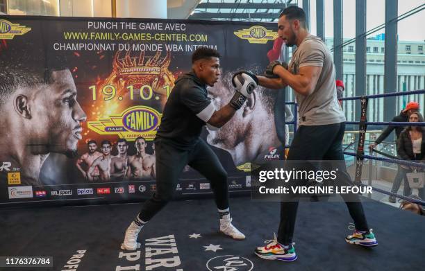 Belgium's Ryad Merhy fights with his Beligum's coach Bilal Ben Sidi during a boxing training session in Charleroi, on October 17 in Charleroi ahead...