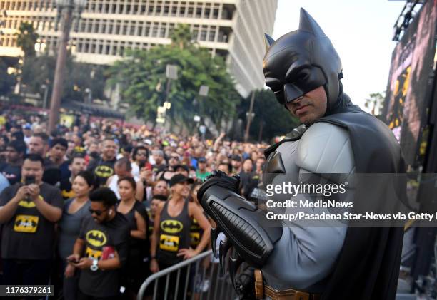 Batman poses at the starting line during the 80th Anniversary of Batman inaugural 5K run and fan experience at Grand Park on Saturday, Sept. 21, 2019...