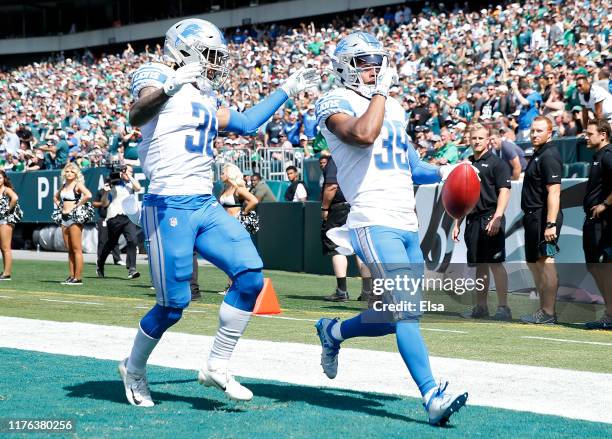 Jamal Agnew of the Detroit Lions celebrates his 100 yard touchdown run with teammate Mike Ford in the first quarter against the Philadelphia Eagles...