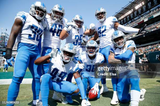 Jamal Agnew of the Detroit Lions celebrates his 100 yard kick off return for a touchdown with teammates Dee Virgin,Nick Bawden,C.J. Moore,Miles...