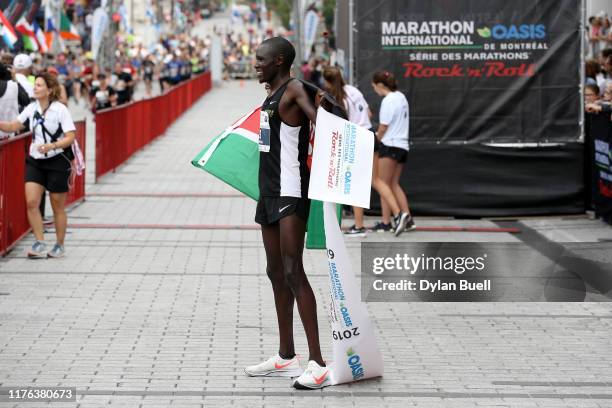 Boniface Kongin of Kenya celebrates after winning the marathon during Oasis International Marathon de Montreal - Day 2 on September 22, 2019 in...