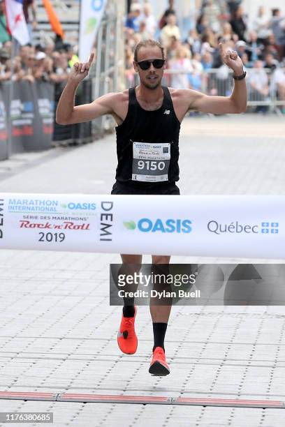 Philippe Viau-Dupuis of Canada wins the men's half marathon during Oasis International Marathon de Montreal - Day 2 on September 22, 2019 in...