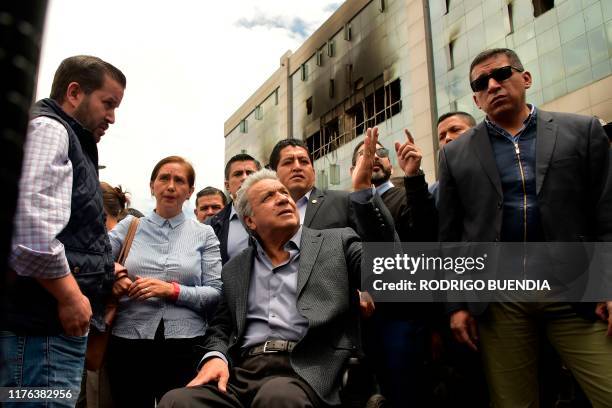 Ecuador's President Lenin Moreno visits the Comptroller General's Office that was set on fire by demonstrators during violent protests over a fuel...