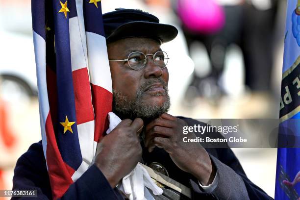 Joe Zellner, a member of the 54th Massachusetts Volunteer Regiment, fixes up his collar during a gathering at the Robert Gould Shaw and Massachusetts...