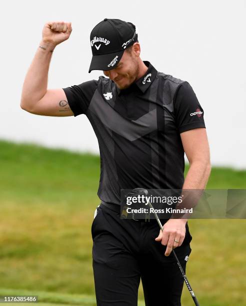 Danny Willett of England celebrates winning the BMW Championship during the final round of of the BMW PGA Championship at Wentworth Golf Club on...