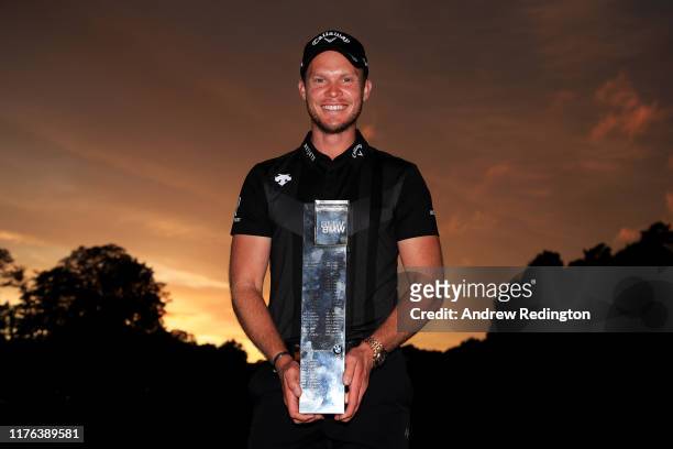 Danny Willett of England poses with the winners trophy following victory in the BMW PGA Championship at Wentworth Golf Club on September 22, 2019 in...
