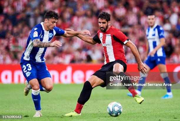 Raul Garcia of Athletic Club duels for the ball with Ximo Navarro of Deportivo Alaves during the Liga match between Athletic Club and Deportivo...