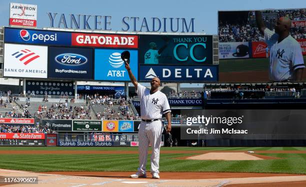 Sabathia of the New York Yankees salutes the crowd as he is honored prior to a game against the Toronto Blue Jays at Yankee Stadium on September 22,...