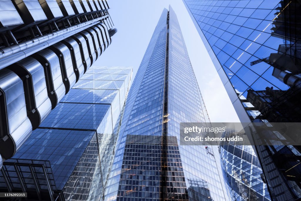Multiple exposure of futuristic London skyscrapers