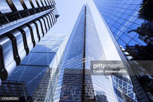 multiple exposure of futuristic london skyscrapers - financial building stock pictures, royalty-free photos & images