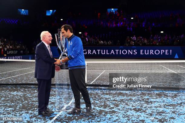 Roger Federer of Team Europe shakes hands with Rod Laver after winning the Laver Cup during Day Three of the Laver Cup 2019 at Palexpo on September...