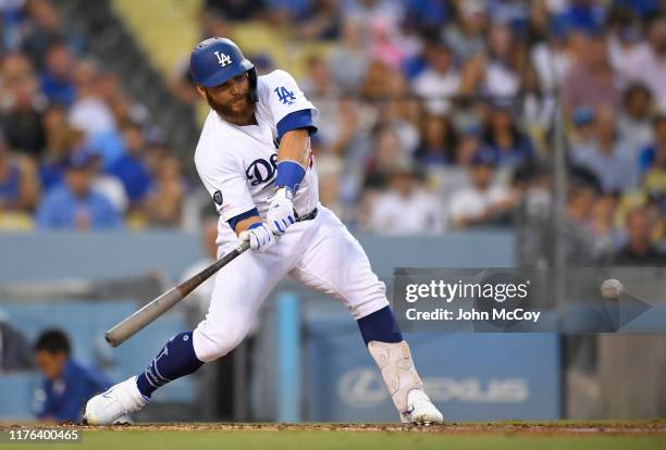 Russell Martin of the Los Angeles Dodgers swings at a pitch against the Colorado Rockies at Dodger Stadium on September 21, 2019 in Los Angeles,...