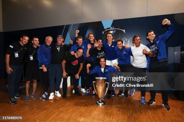 Team Europe players and backroom staff pose with the trophy after winning the Laver Cup in the final match of the tournament during Day Three of the...