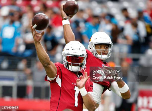 Quarterbacks Kyler Murray and Brett Hundley of the Arizona Cardinals warm up prior to the NFL football game against the Carolina Panthers at State...