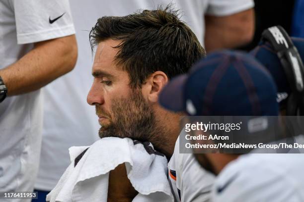 Joe Flacco of the Denver Broncos sits on the bench as the defense works against the Green Bay Packers during the second half of the Packers' 27-16...