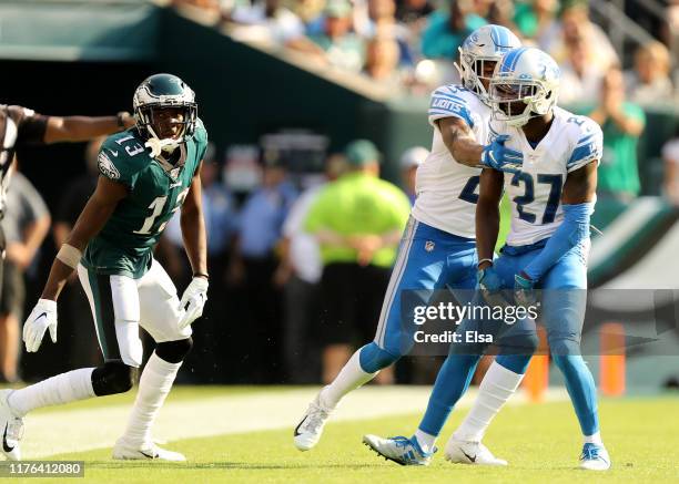 Justin Coleman of the Detroit Lions celebrates with teammate Will Harris after Coleman broke up a pass intended for Nelson Agholor of the...
